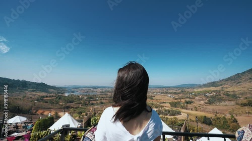 young Japanese teen girl brunette women tourist adult woman asian mature looking the sky outdoors on a hike mountains camping taking a photo with lover viewpoint at Chiang mai, Mon Jam, Thailand.
