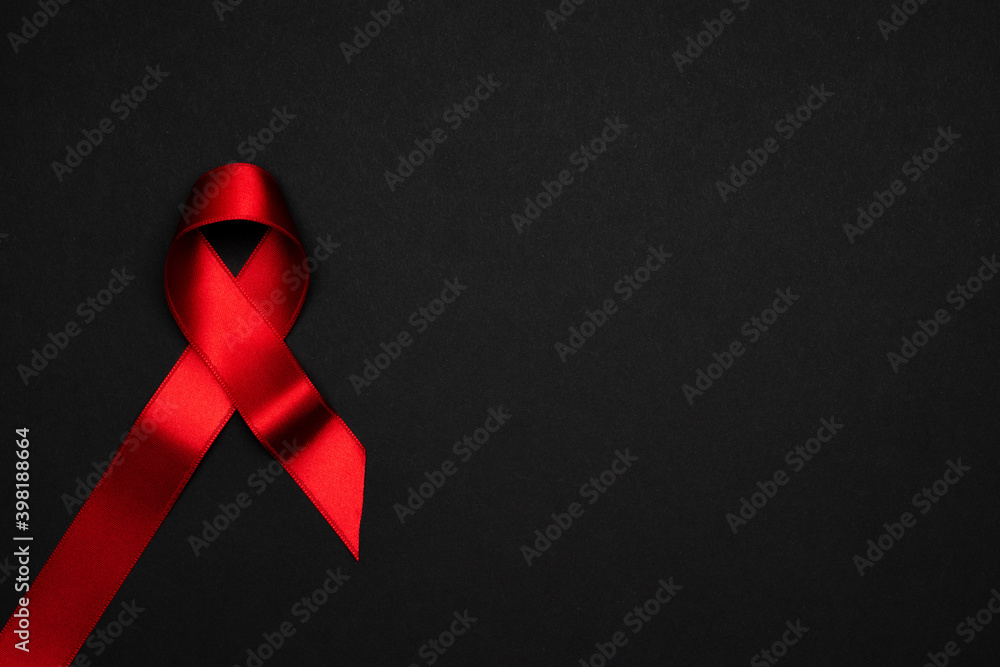 Aids day. Red ribbon symbol in hiv world day on dark background ...