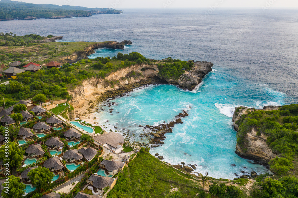 Dramatic view of the stunning blue lagoon by cliffs in Nusa Ceningan island in Bali, Indonesia