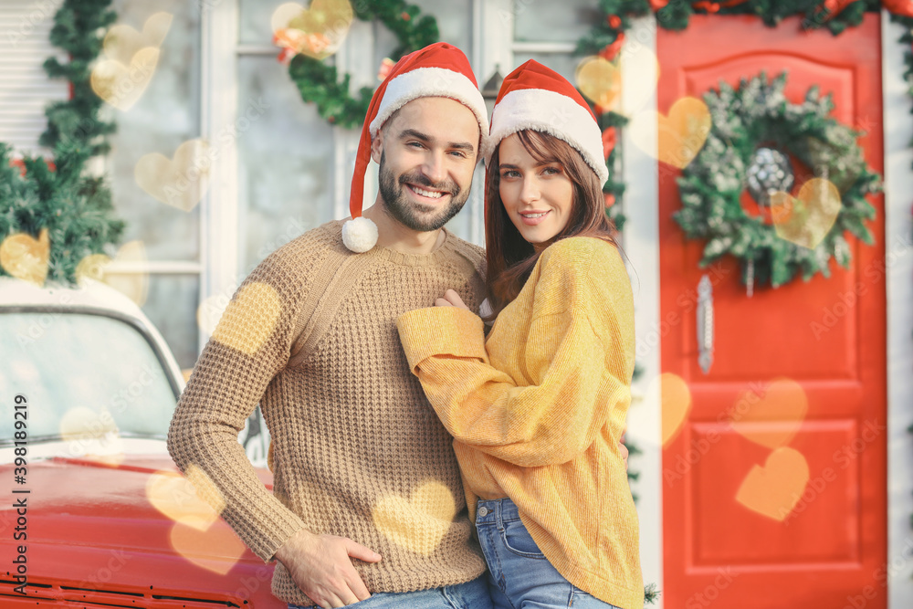 Happy couple celebrating Christmas outdoors Happy couple celebrating Christmas outdoors