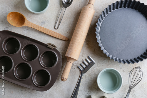 Set of kitchen utensils for bakery on grey background