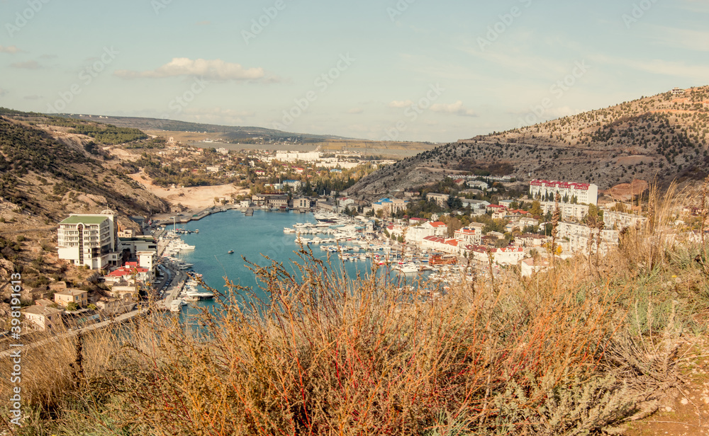 Beautiful sea view of Balaklava Bay. View from the mountain. Early autumn. Morning. Horizontal photo.