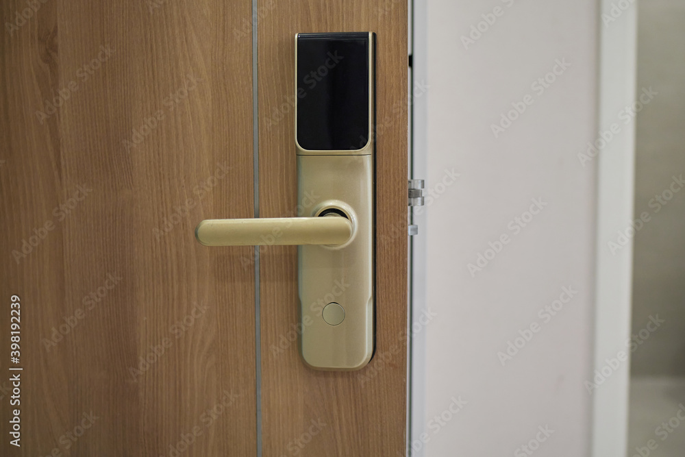 Digital door lock security systems for good safety of apartment door. Electronic door handle with key pads numbers. Selective focus Digital door lock security systems for good safety of apartment door. Electronic door handle with key pads numbers. Selective focus