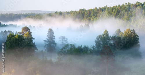 Foggy sunrise in a national park in the Urals