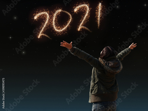 happy Asian girl open arm with joyful on countdown night with firework light for 2021 year. image of happy new year celebration party for seasonal and holiday background wallpaper