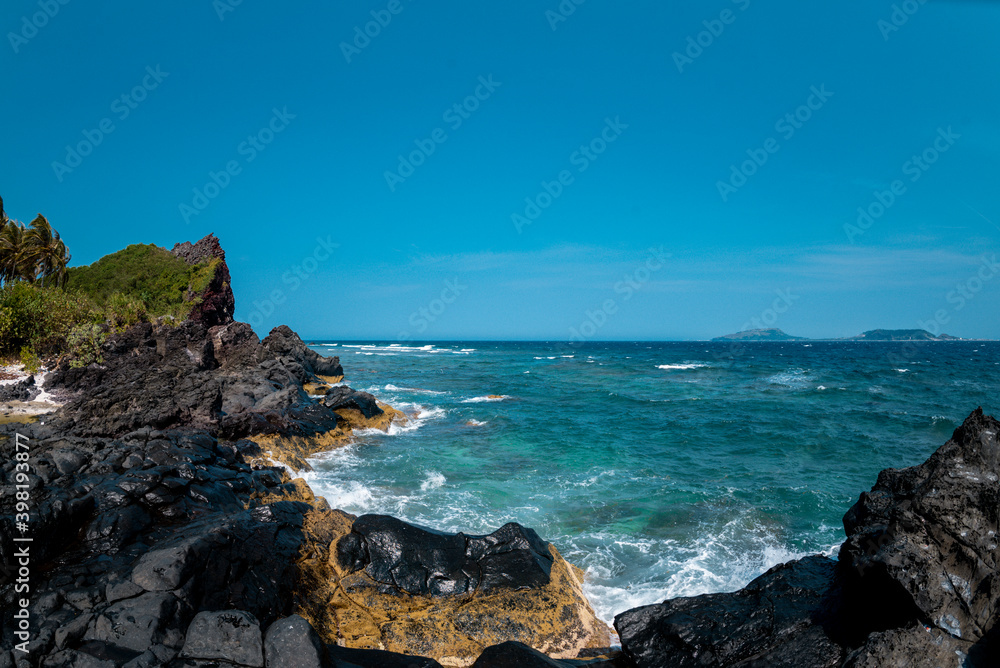 Tropical beach with suny views and waves, rocks and sand background. Travel destinations in Ly Son island, Vietnam  and banner web.