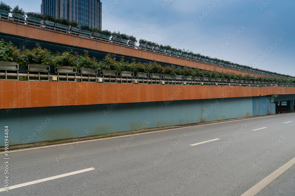 Concrete structure and asphalt road space under the overpass in the city Concrete structure and asphalt road space under the overpass in the city