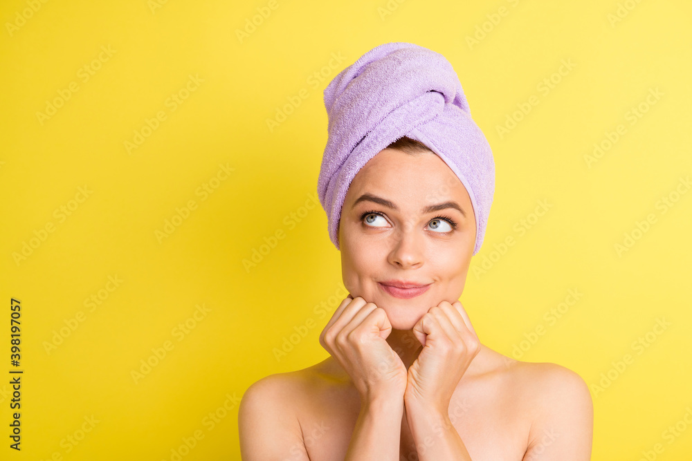 Close-up portrait of pretty minded girl wearing turban on head thinking copy space choose isolated over bright yellow color background Close-up portrait of pretty minded girl wearing turban on head thinking copy space choose isolated over bright yellow color background
