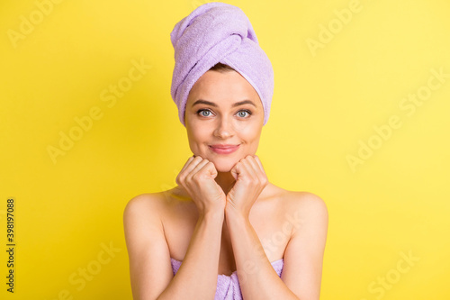 Close-up portrait of pretty cute girl wearing turban on head enjoying fresh soft skin isolated over bright yellow color background