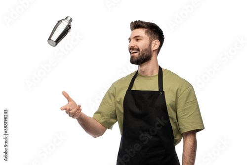alcohol drinks, people and job concept - happy smiling barman with shaker preparing cocktail over white background photo