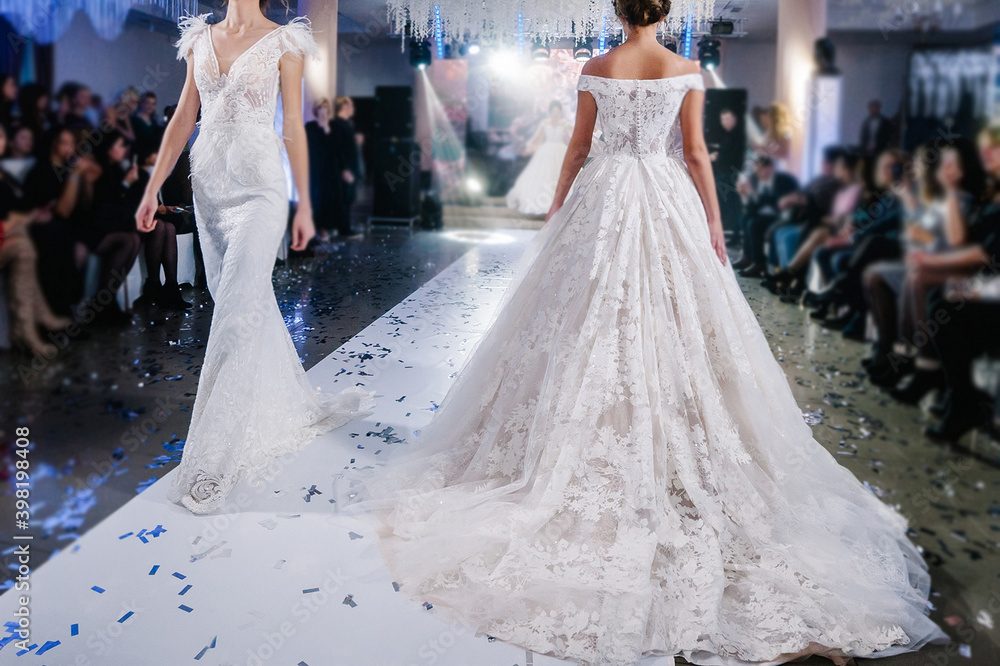 Female models walk the runway in beautiful stylish white wedding