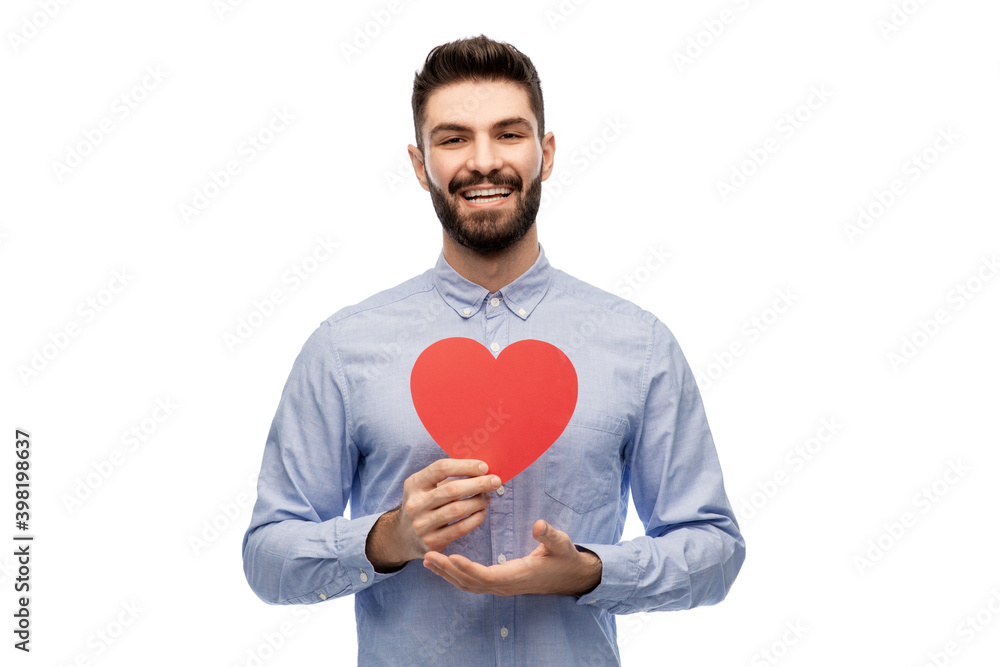 romance, love and people concept - happy smiling young man with red heart over white background romance, love and people concept - happy smiling young man with red heart over white background