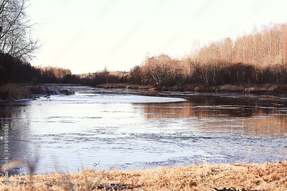 Fototapeta premium freezing river november december, seasonal landscape in nature winter
