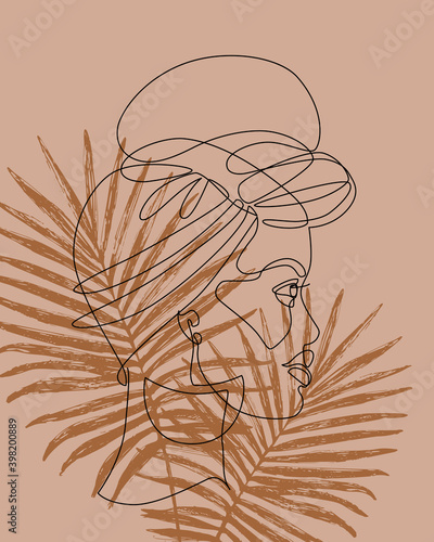 Afro girl in turban on palm leaves background
