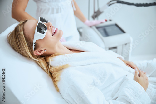 Cheerful woman client anticipating a beauty procedure