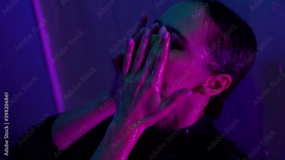 depression and sad feelings of young beautiful woman, she is standing in shower at night, closeup portrait depression and sad feelings of young beautiful woman, she is standing in shower at night, closeup portrait