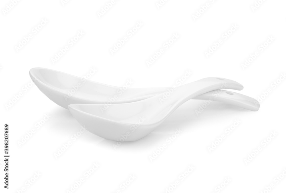 White empty ceramic spoon for soup on white background White empty ceramic spoon for soup on white background
