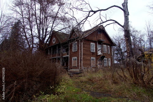 A very old  dilapitated  abandoned house  on a dark overcast day.