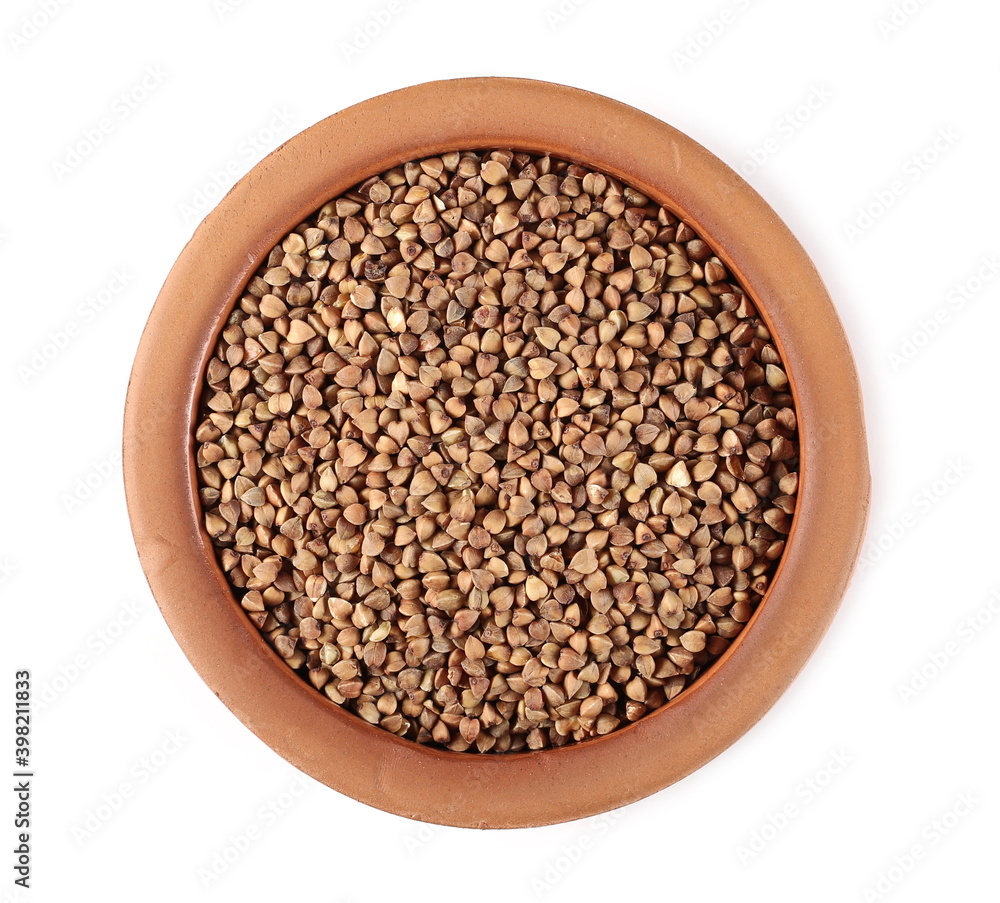 Buckwheat seed pile in clay pot, bowl isolated on white background, top view Buckwheat seed pile in clay pot, bowl isolated on white background, top view