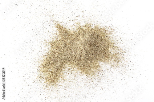 Milled white pepper powder pile, peppercorn isolated on white background, top view