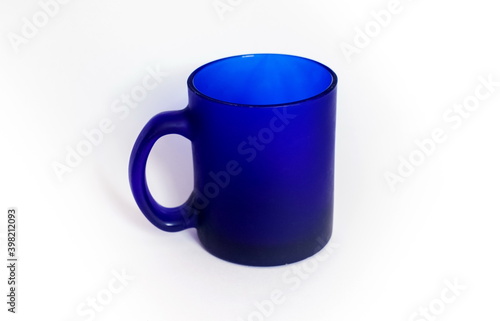 Purchased mug of blue glass closeup on a white background