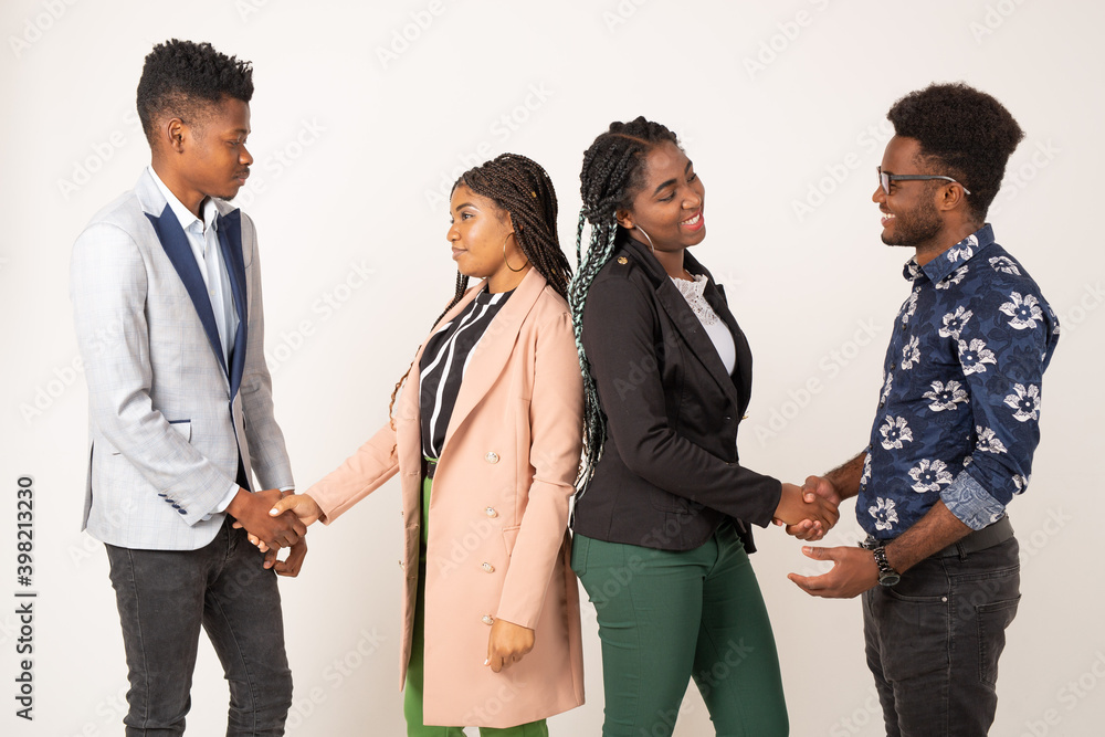 beautiful young african people on white background shaking hands beautiful young african people on white background shaking hands