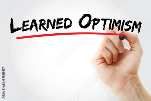 Photography Learned Optimism text with marker, concept background