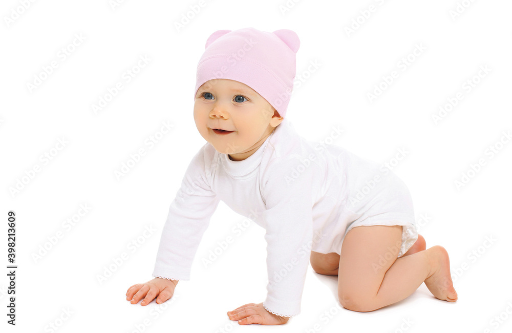 Portrait of cute little baby crawling in pink hat over a white background Portrait of cute little baby crawling in pink hat over a white background