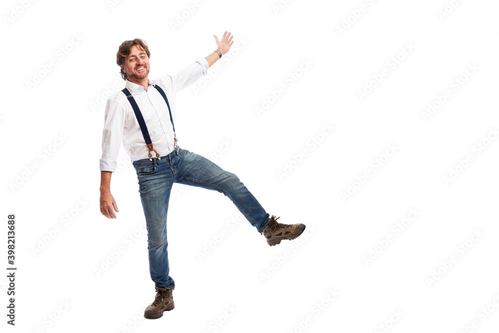A man with red hair in a white shirt and jeans is jumping. Isolated on white background. Space for text. Baner.