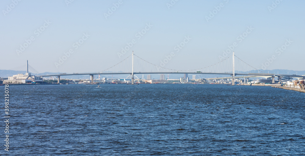 Konohana Bridge over the sea. It is located at Osaka bay in Japan.