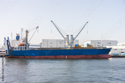 Fotografija Break bulk or general cargo ship with cranes at port