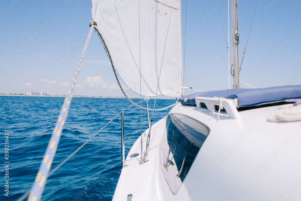 Yacht sailing in calm sea on sunny day. Yacht sailing in calm sea on sunny day.