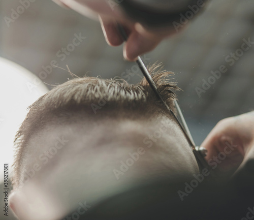 Man Barber in men's hairdresser
