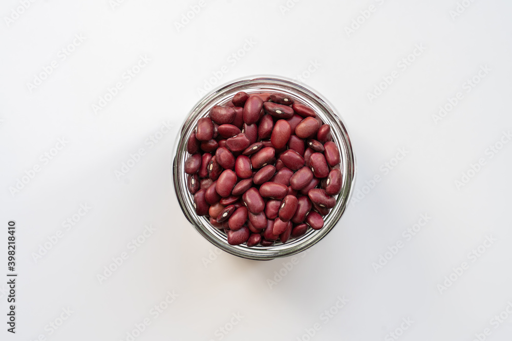 glass jar with red kidney bean on white beige background top view photo isolated glass jar with red kidney bean on white beige background top view photo isolated