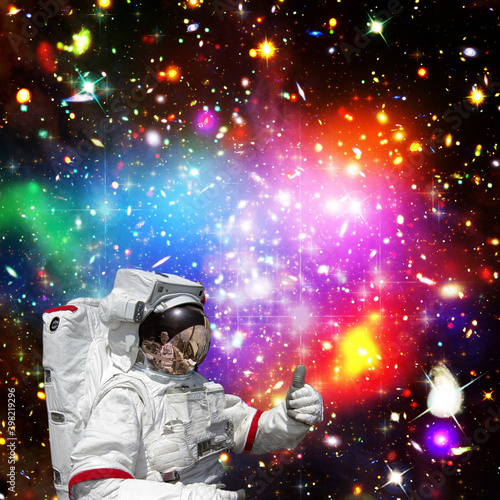 Astronaut and galaxy. The elements of this image furnished by NASA.