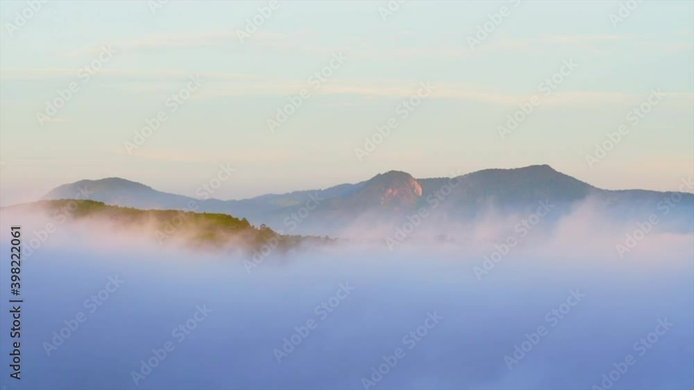 Beautiful landscape of Cau Dat, Da Lat city, Viet Nam. Early morning, forest trees with clouds and mist fog Beautiful landscape of Cau Dat, Da Lat city, Viet Nam. Early morning, forest trees with clouds and mist fog