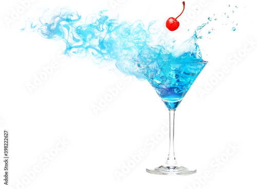 Red cherry falling into a smoky and splashing blue cocktail isolated on white with space for text and images.