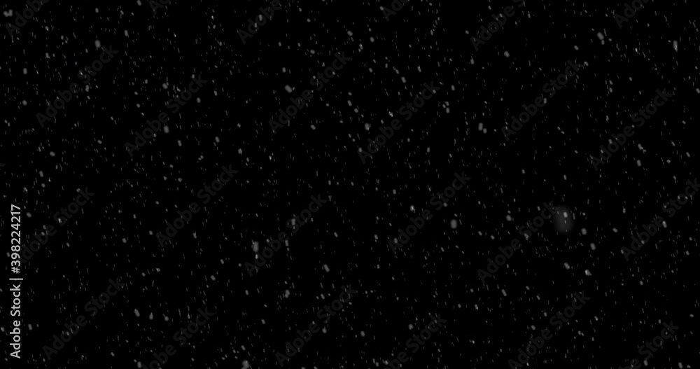Falling snow against black background for overlay. Alpha. Falling snow against black background for overlay. Alpha.