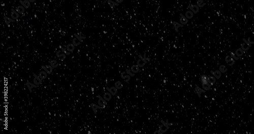 Falling snow against black background for overlay. Alpha.