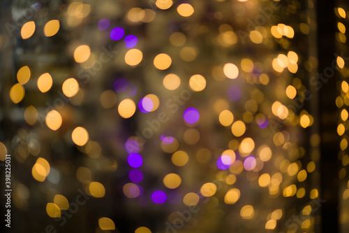 Golden abstract blurred defocused bokeh background. Abstract light background with light spots