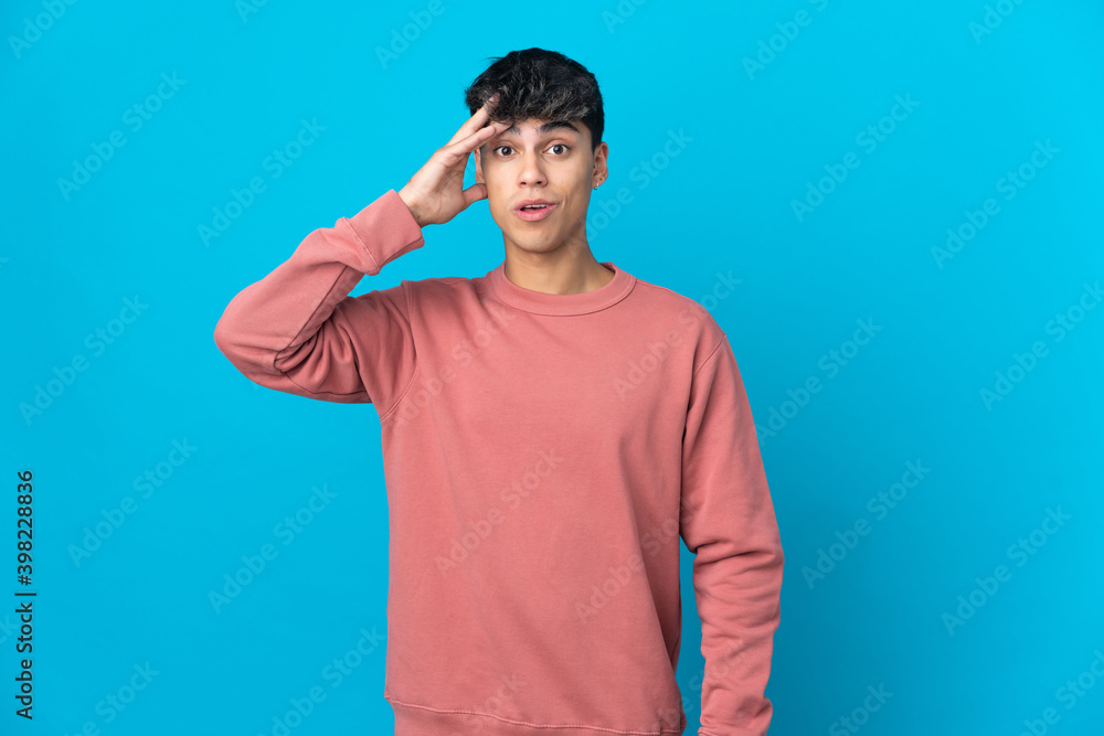 Young man over isolated blue background has realized something and intending the solution Young man over isolated blue background has realized something and intending the solution