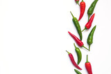 green and red hot chili peppers on a white background with space for text. 