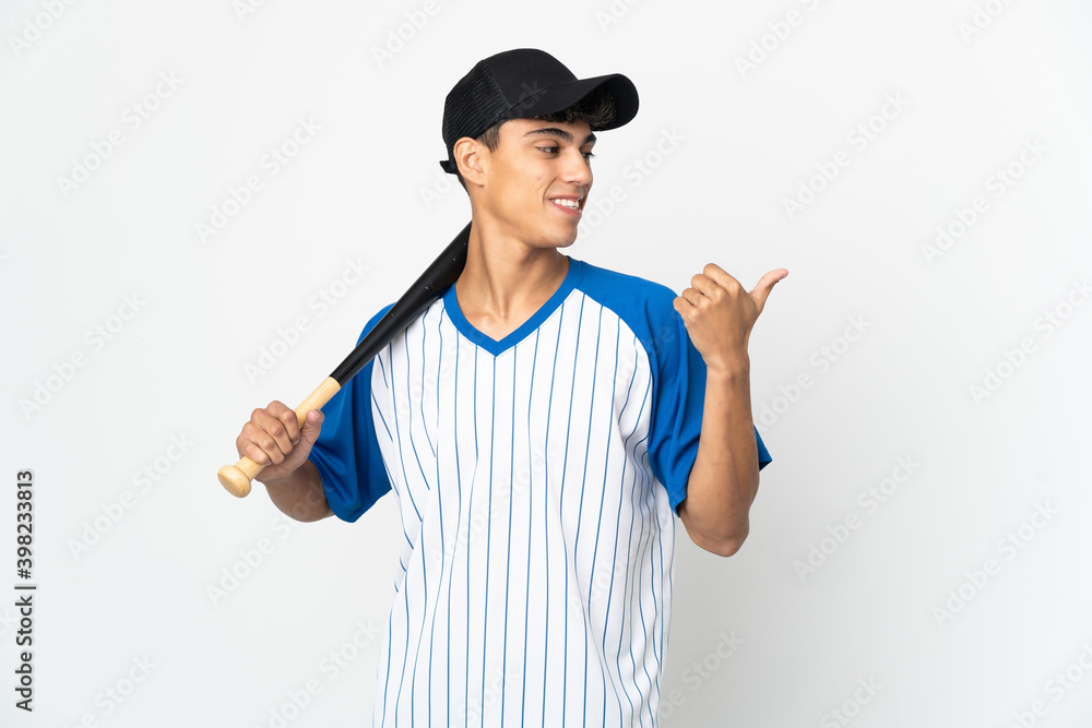 Man playing baseball over isolated white background pointing to the side to present a product
