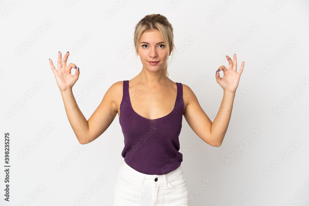 Young Russian woman isolated on white background in zen pose Young Russian woman isolated on white background in zen pose