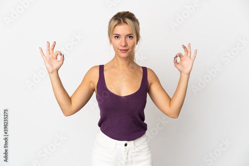 Young Russian woman isolated on white background in zen pose © luismolinero