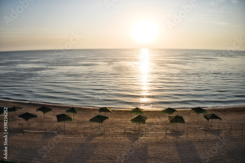 Beach umbrellas at sunrise