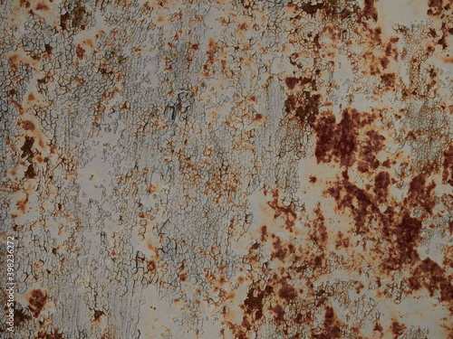 Rust.Old blue painted wall with rust spots.Textured rusty metal background. Rust stains through the cracked blue paint.