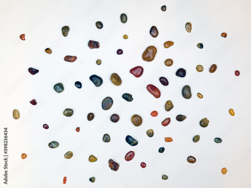 A group of dark and light, large and small carnelians.