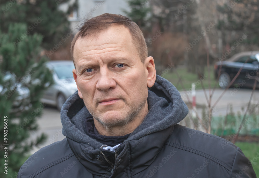 Autumn portrait of handsome charming middle aged man outdoors Autumn portrait of handsome charming middle aged man outdoors