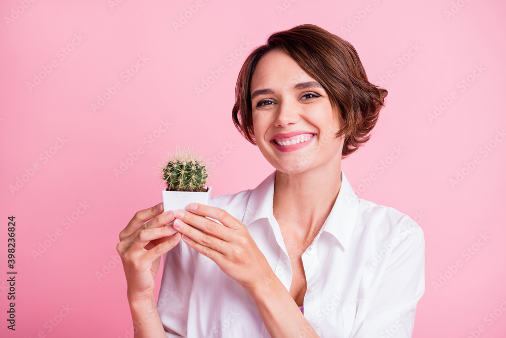 Portrait of satisfied person arms hold little cactus plant growing home isolated on pink color background